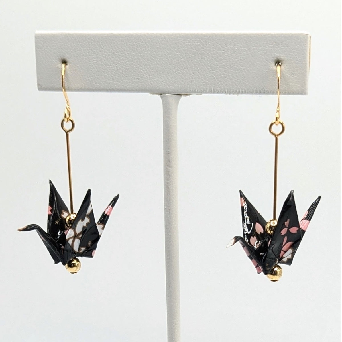 Black Blossom Origami Crane Earrings, close-up of the pair