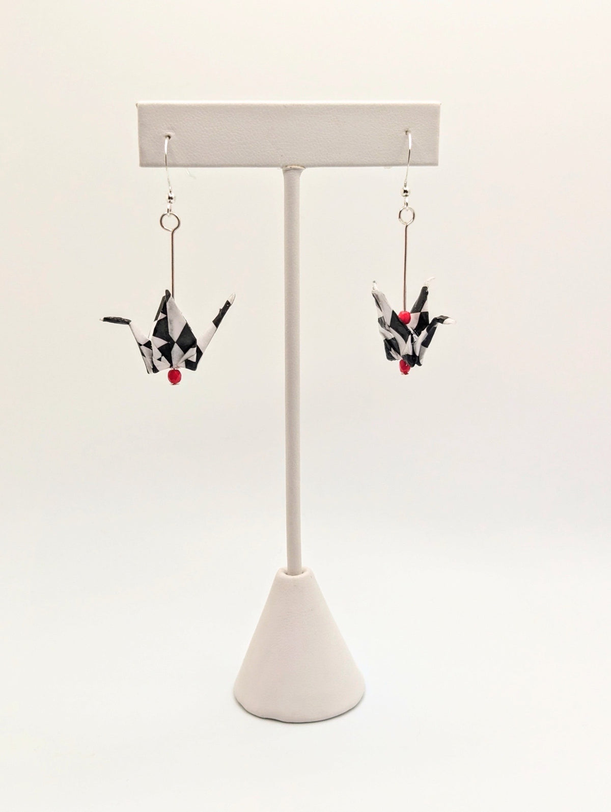 Harlequin Pattern Chiyogami Origami Crane Earrings, shown with silver ear wires